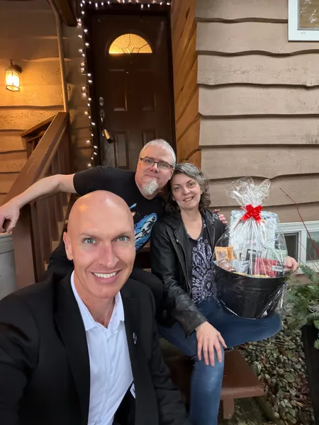 Kyle with happy clients at their new home