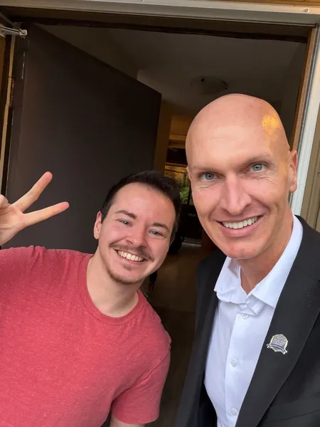 Kyle celebrating with a satisfied client