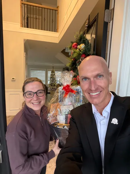 Kyle with a client during the holidays