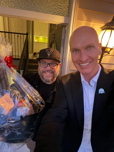 Kyle delivering a gift basket to a client